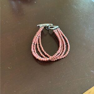 beautiful rose/pink triple strand beaded bracelet